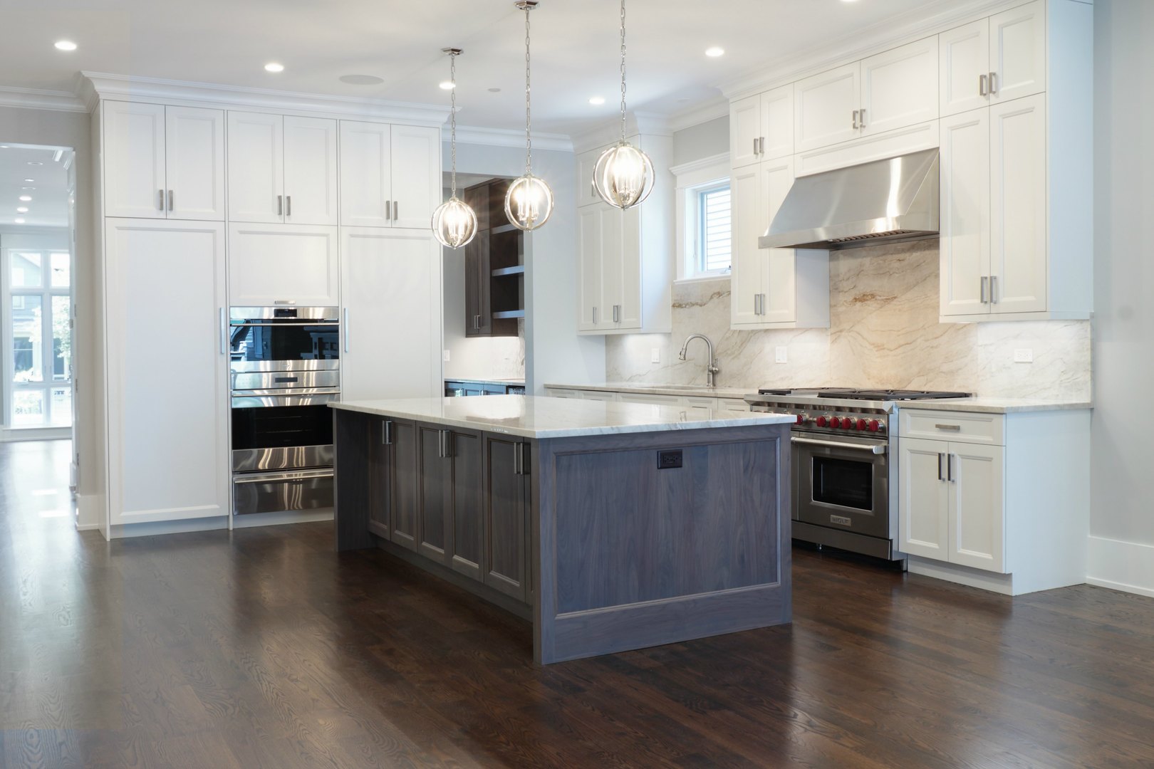 733 West Melrose Street, Unit 2 Chicago, IL 60657 - Photo 2 of 18 a kitchen with stainless steel appliances granite countertop a stove a sink and a refrigerator