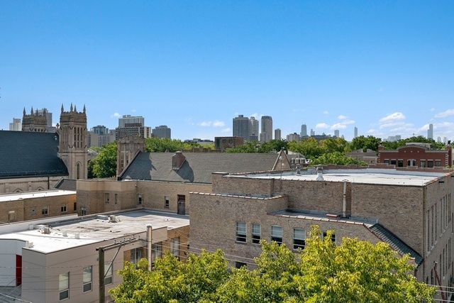 733 West Melrose Street, Unit 2 Chicago, IL 60657 - Photo 15 of 18 a view of a swimming pool with a yard