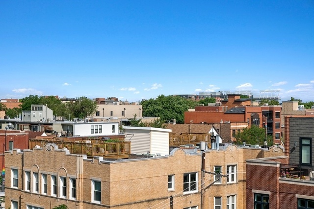 733 West Melrose Street, Unit 2 Chicago, IL 60657 - Photo 18 of 18 an aerial view of residential houses with outdoor space