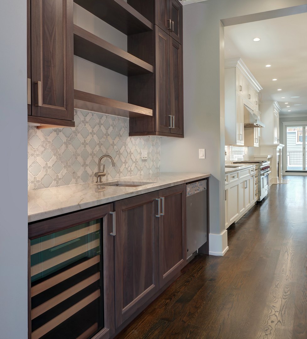 733 West Melrose Street, Unit 2 Chicago, IL 60657 - Photo 5 of 18 a kitchen with stainless steel appliances a sink and cabinets