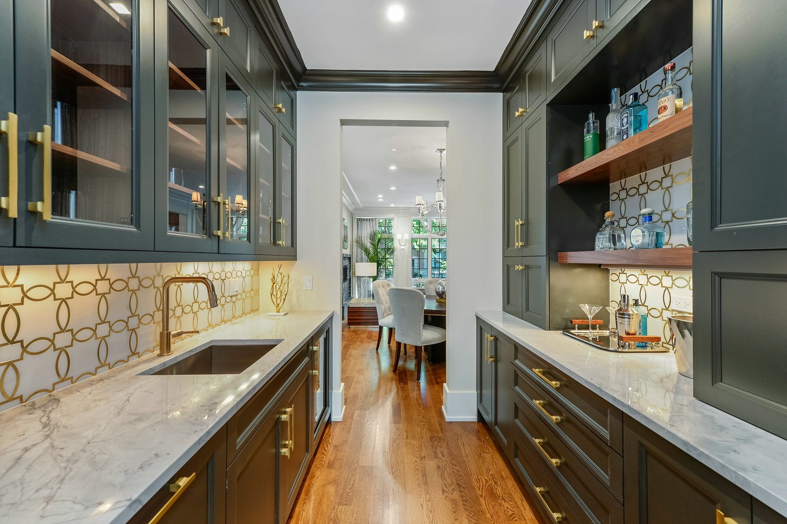 733 West Melrose Street, Unit 2 Chicago, IL 60657 - Photo 6 of 18 a kitchen with stainless steel appliances granite countertop lots of counter top space and wooden floor