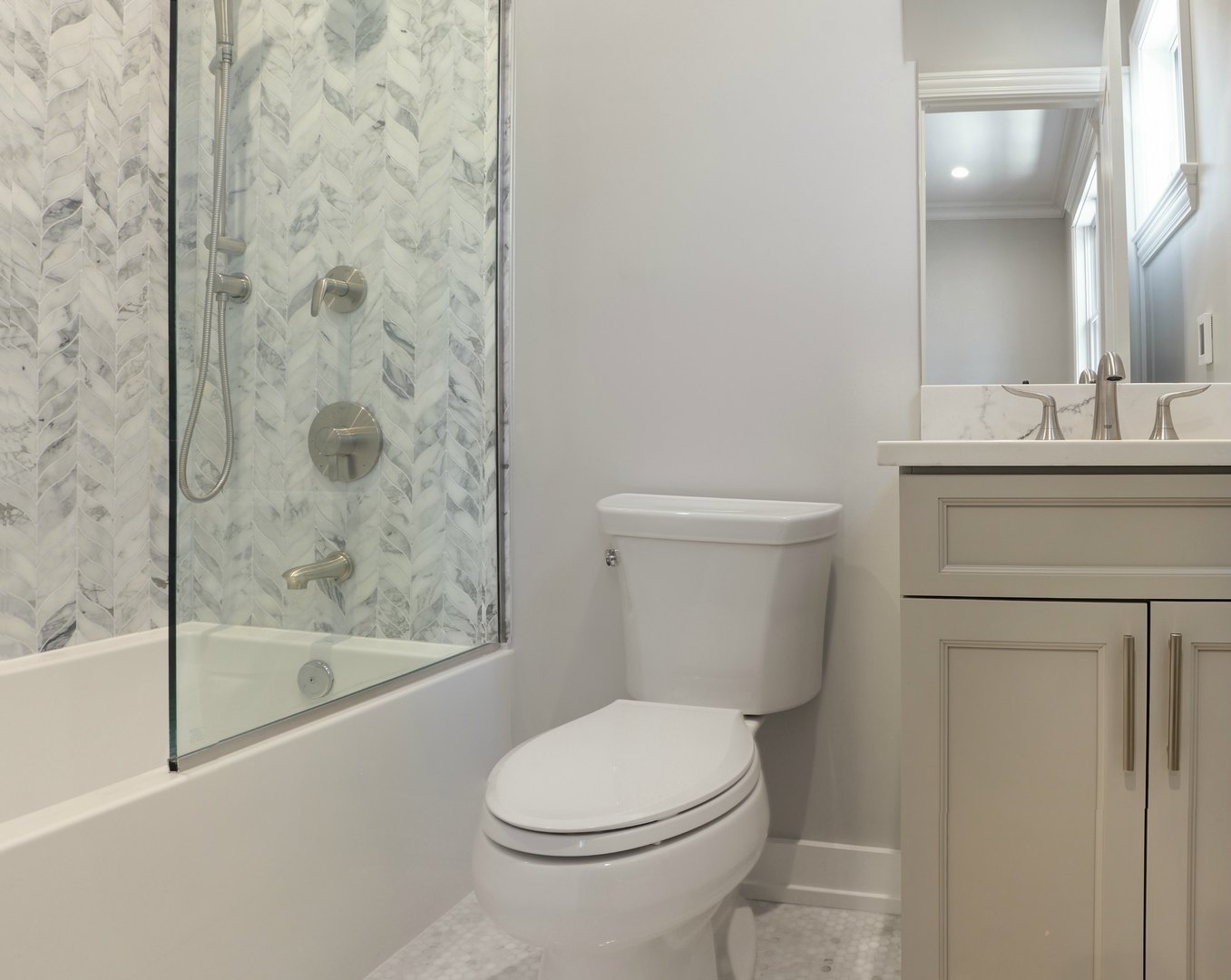 733 West Melrose Street, Unit 2 Chicago, IL 60657 - Photo 10 of 18 a bathroom with a sink a toilet and shower