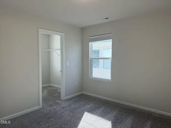 a en suite bathroom with a sink and mirror
