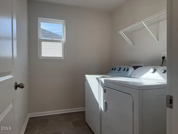 a bathroom with a shower sink and mirror