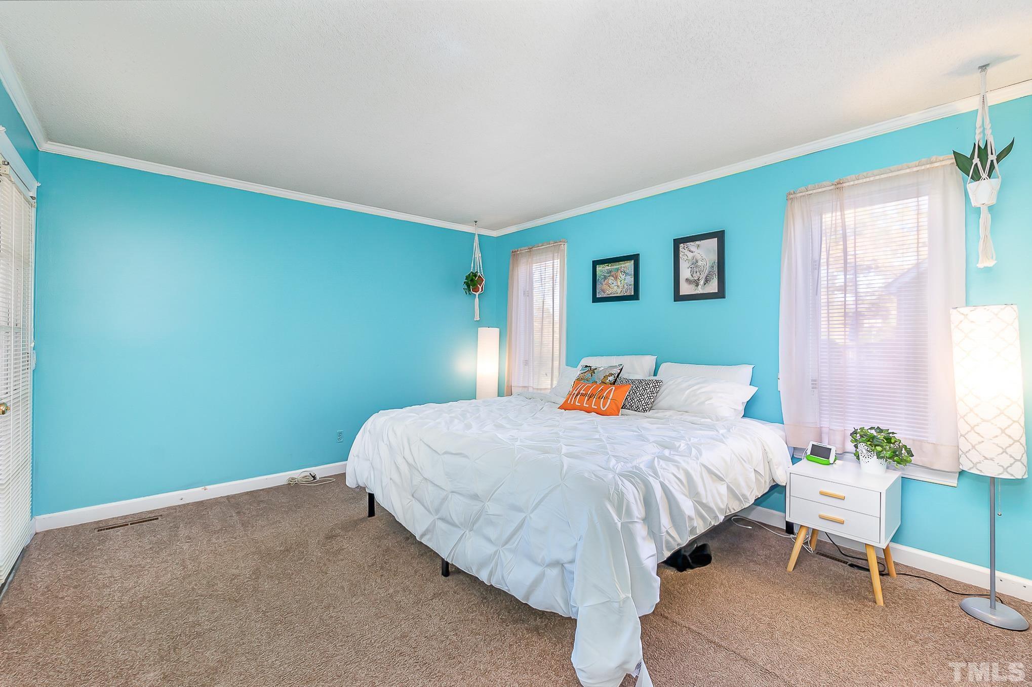 2904 Hodges Road Kinston, NC 28504 - Photo 17 of 29 a bed sitting in a bedroom next to a window
