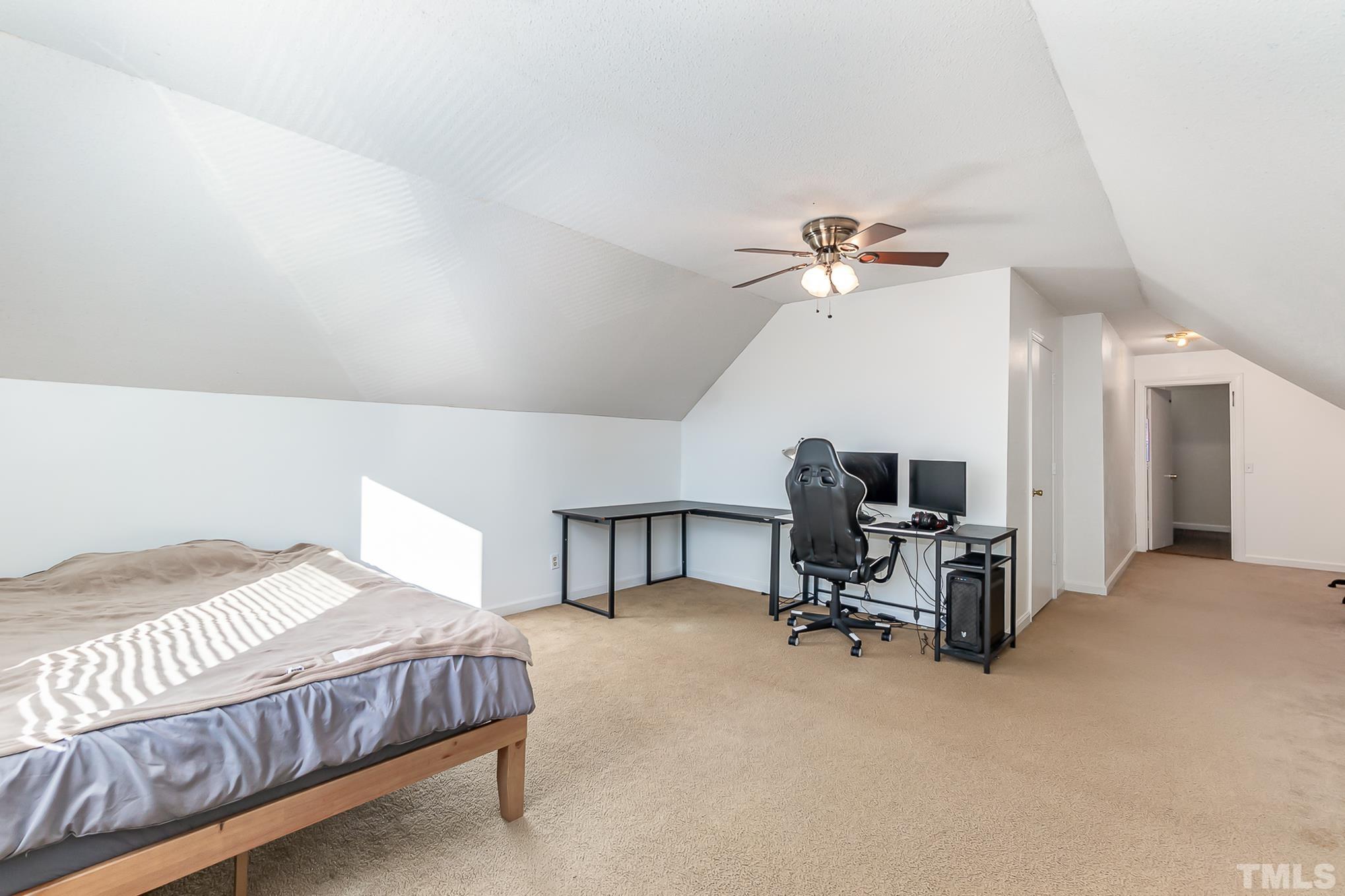 2904 Hodges Road Kinston, NC 28504 - Photo 25 of 29 a workspace with a couch and a chandelier