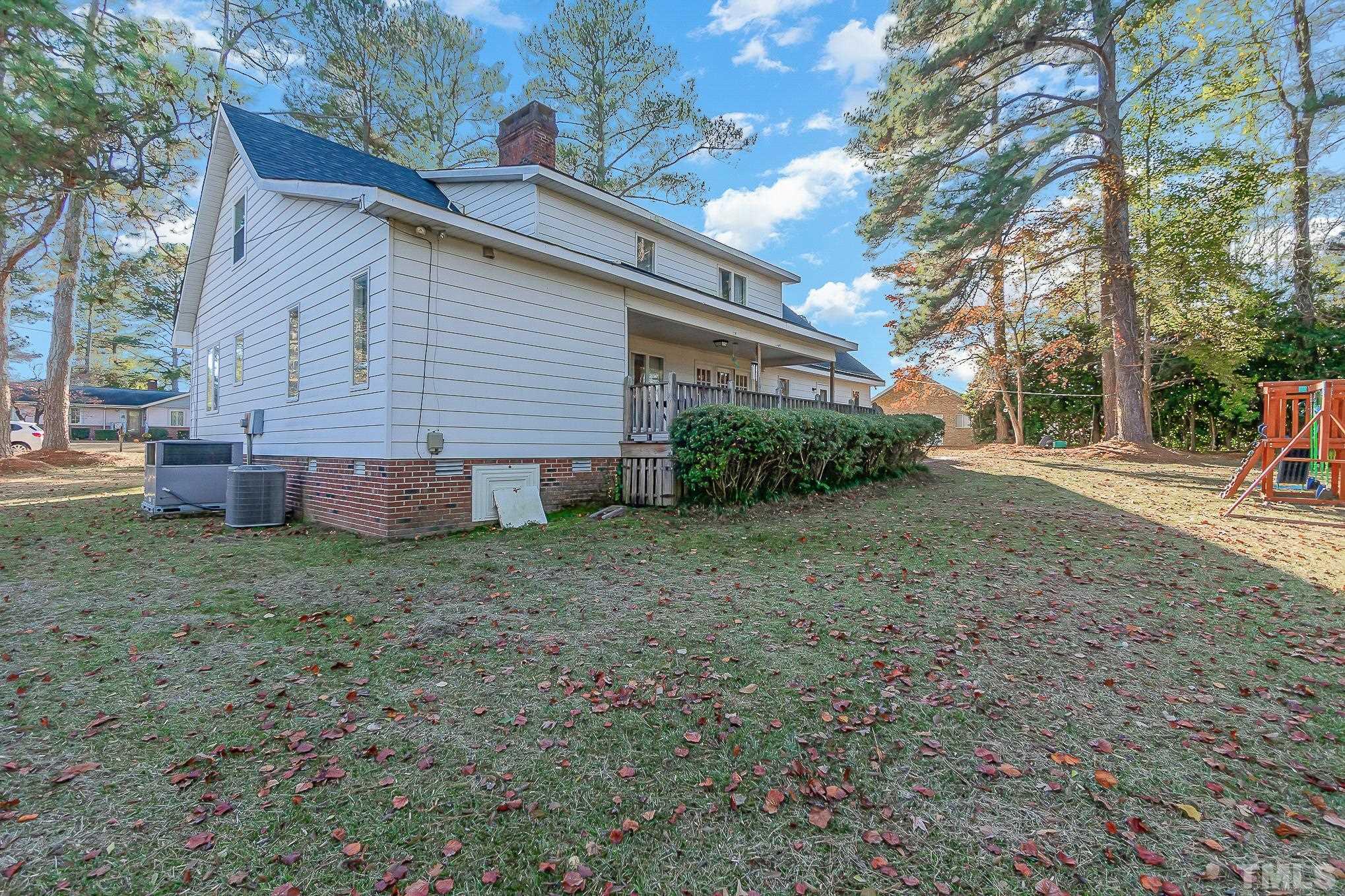 2904 Hodges Road Kinston, NC 28504 - Photo 29 of 29 a view of a backyard with a large tree