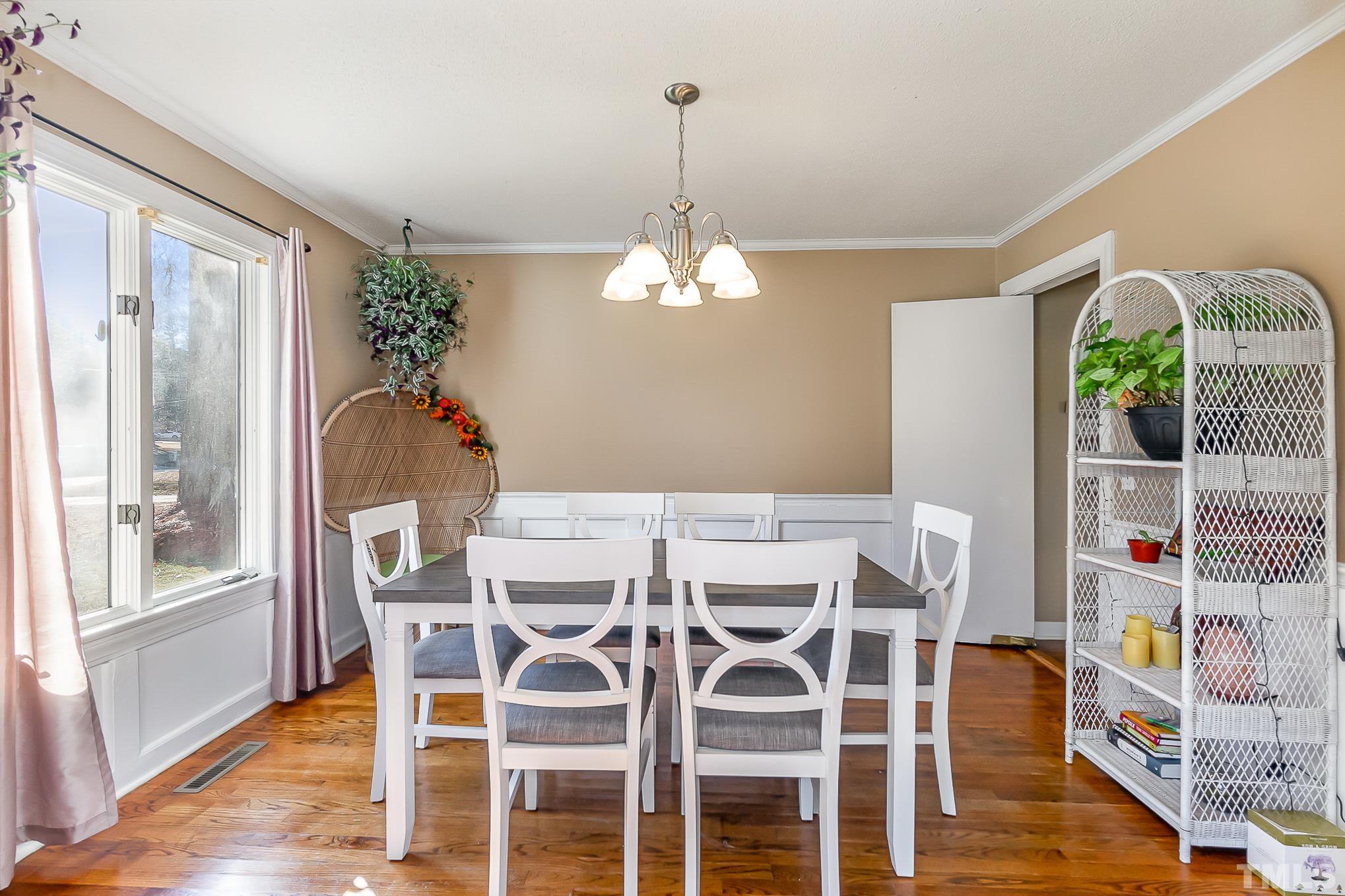 2904 Hodges Road Kinston, NC 28504 - Photo 8 of 29 a view of a dining room with furniture window and wooden floor