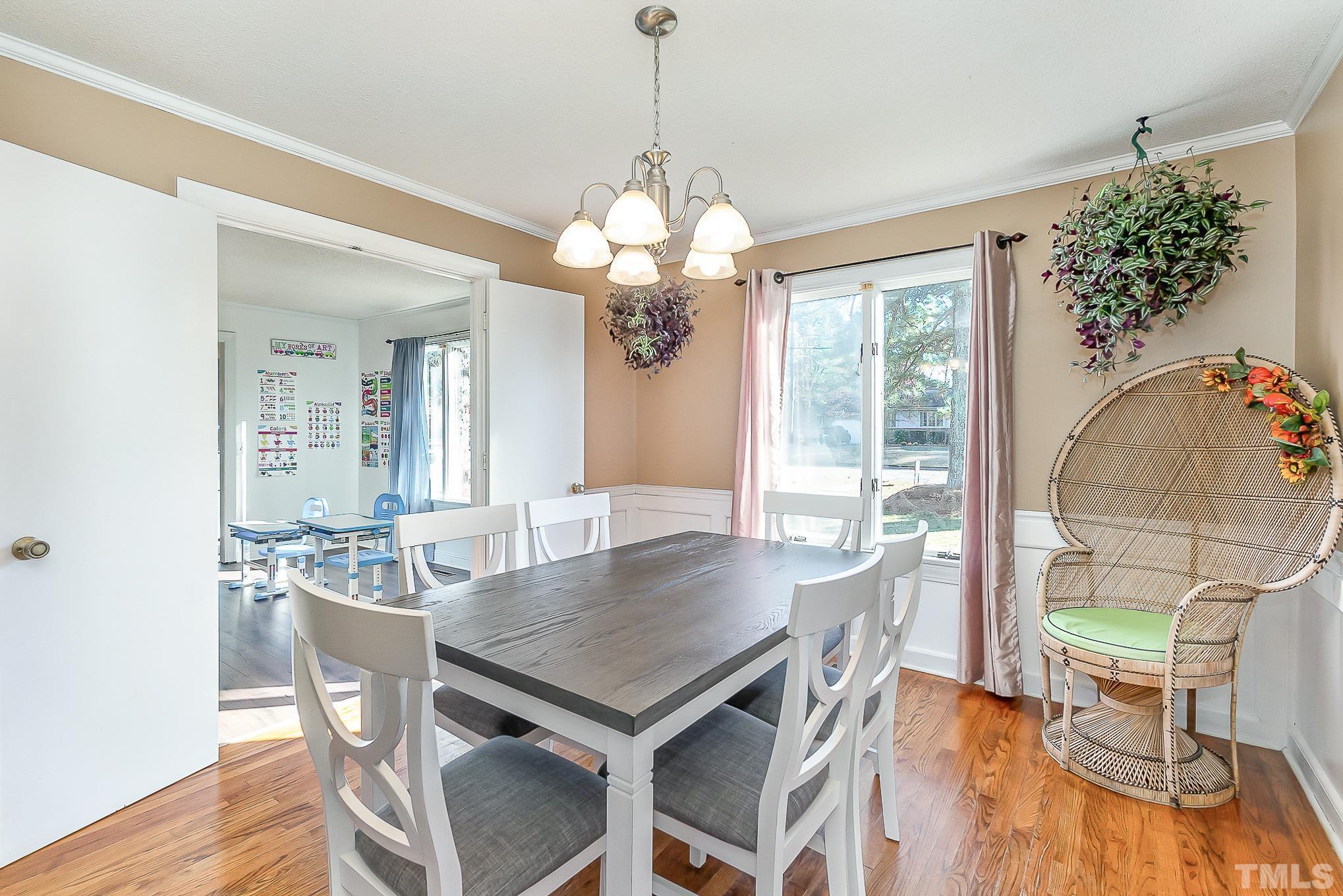 2904 Hodges Road Kinston, NC 28504 - Photo 9 of 29 a view of a dining room with furniture wooden floor and chandelier