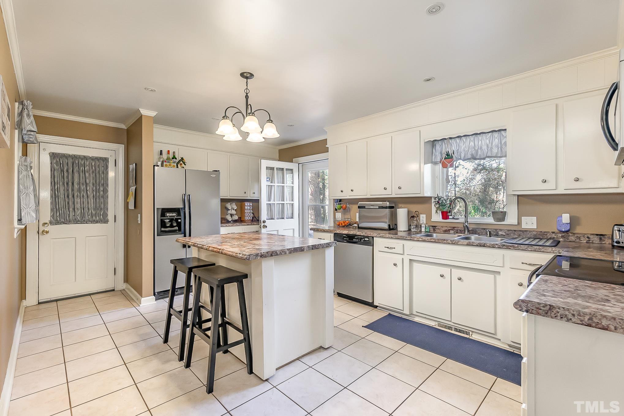 2904 Hodges Road Kinston, NC 28504 - Photo 10 of 29 a kitchen with granite countertop cabinets a sink and appliances