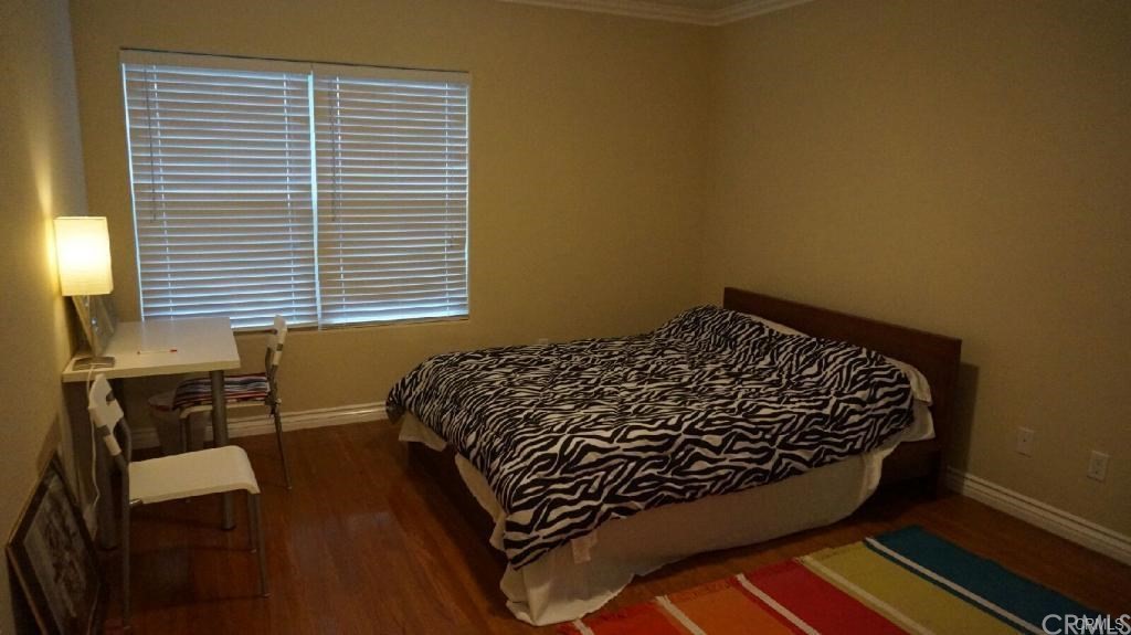 611 South Old Ranch Road Arcadia, CA 91007 - Photo 12 of 17 a bed sitting in a bedroom next to a window