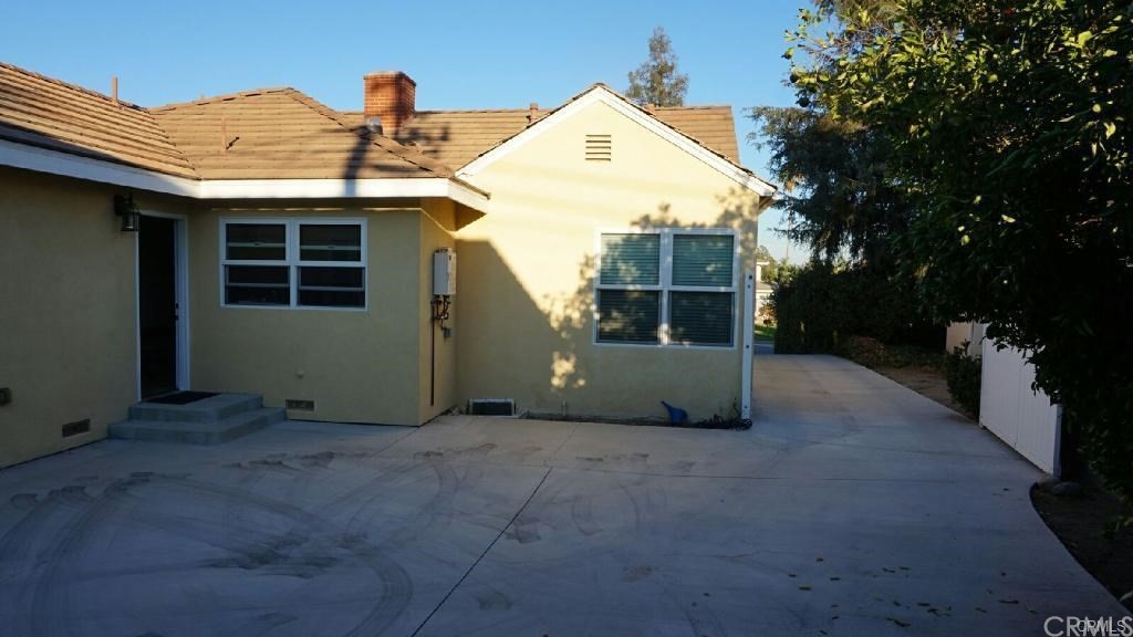 611 South Old Ranch Road Arcadia, CA 91007 - Photo 16 of 17 a view of a house with a backyard