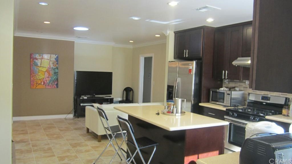 611 South Old Ranch Road Arcadia, CA 91007 - Photo 4 of 17 a large kitchen with a table and chairs