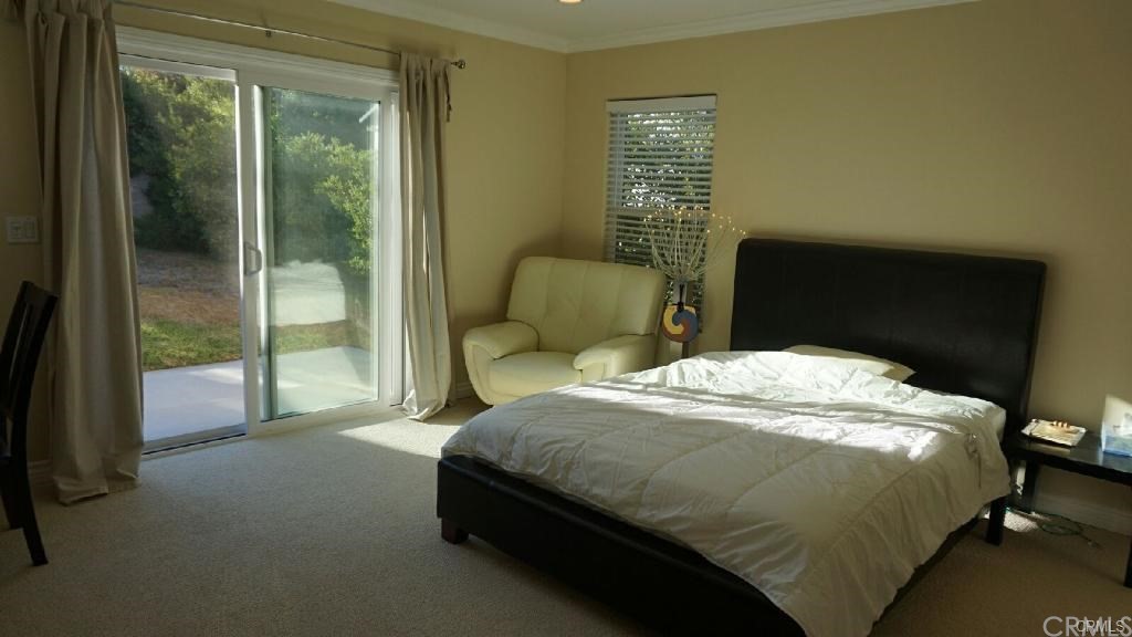 611 South Old Ranch Road Arcadia, CA 91007 - Photo 7 of 17 a bedroom with a bed and window
