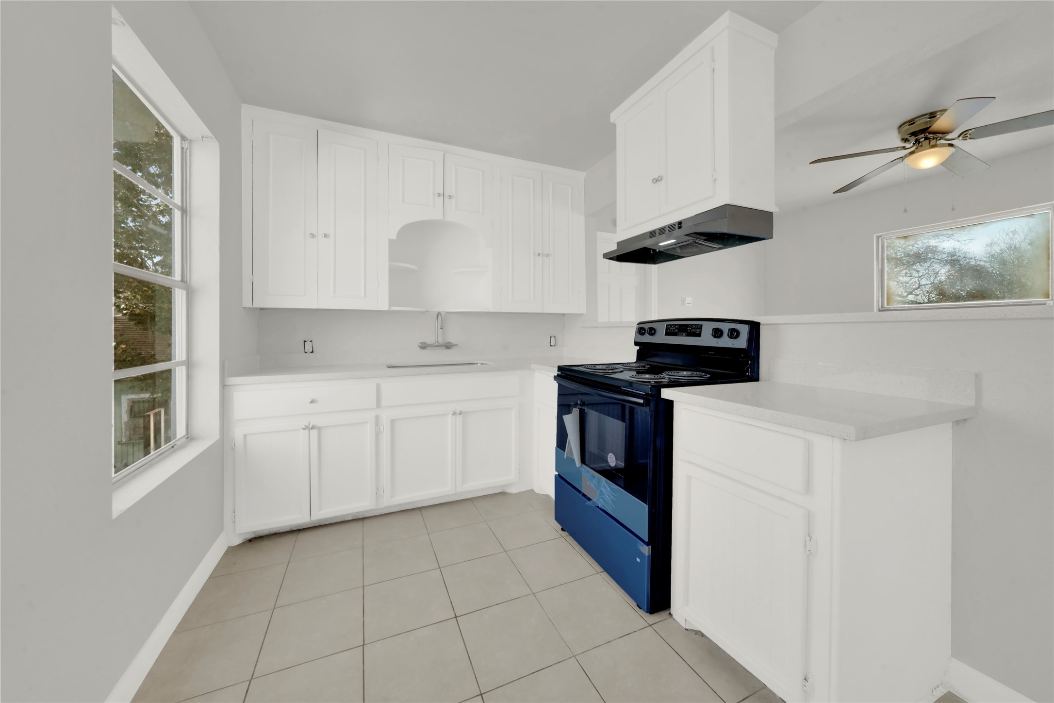 106 Hanover Street Houston, TX 77012 - Photo 42 of 49 a kitchen with cabinets appliances and a window