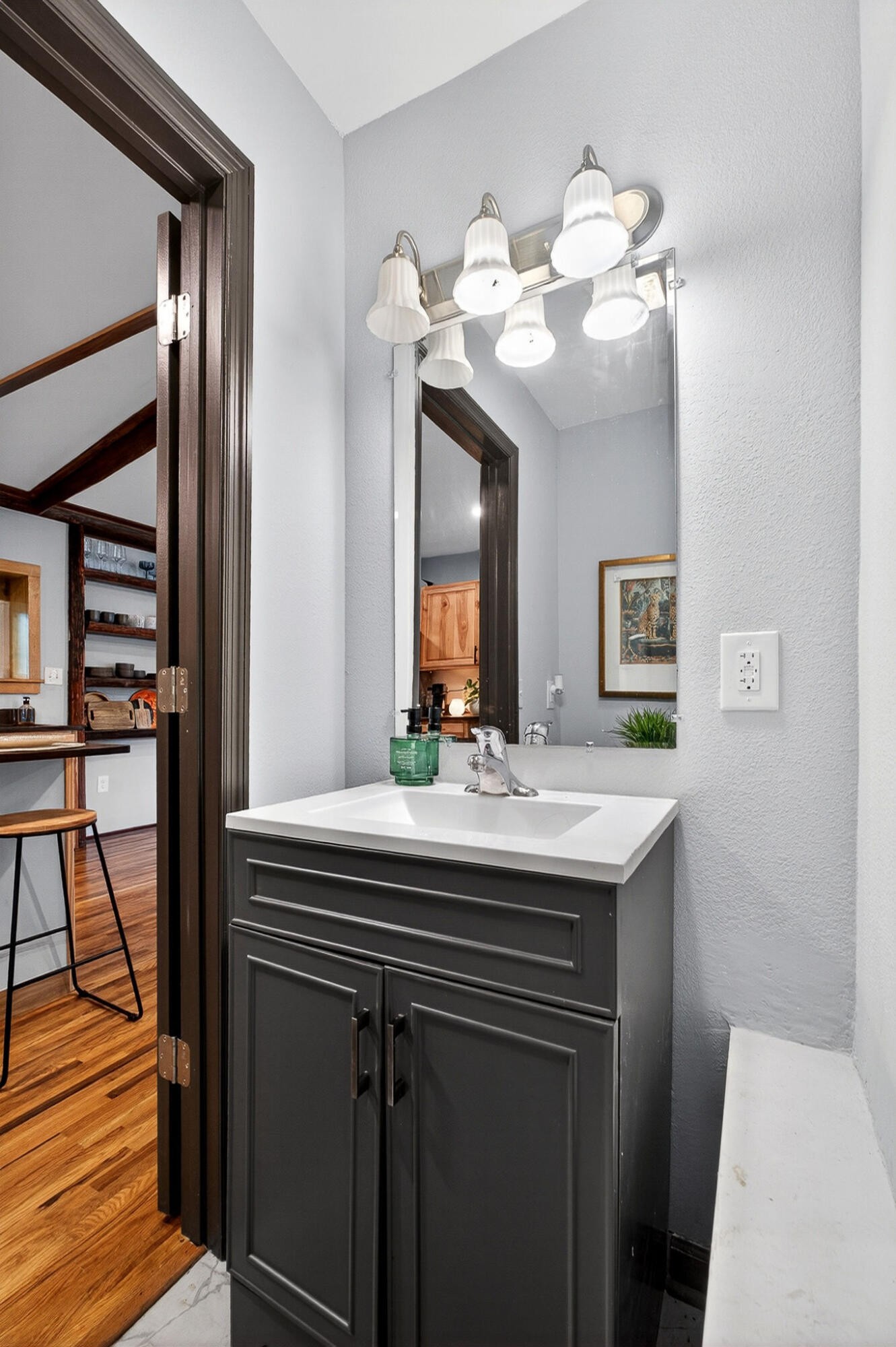 9388 Harrison Ferry Road McMinnville, TN 37110 - Photo 11 of 41 a bathroom with a sink a mirror and vanity