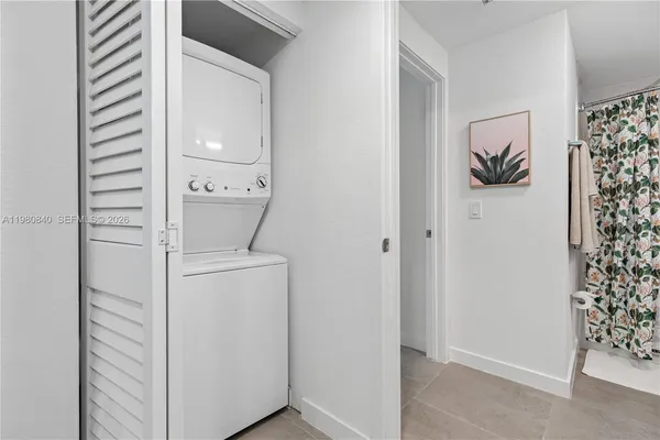 a room that has a rug and a window