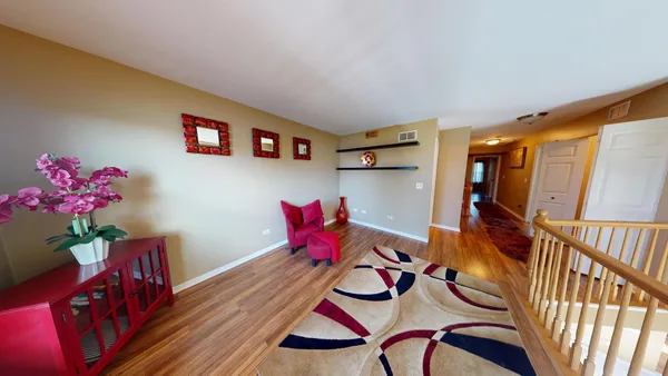 a view of an entryway with wooden floor