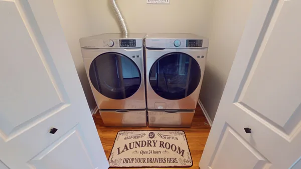 a utility room with dryer and washer