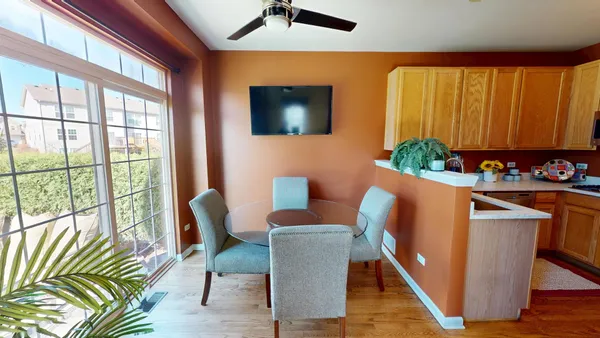 a view of a dining room with furniture window and wooden floor