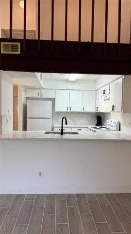 a view of cabinets and chair