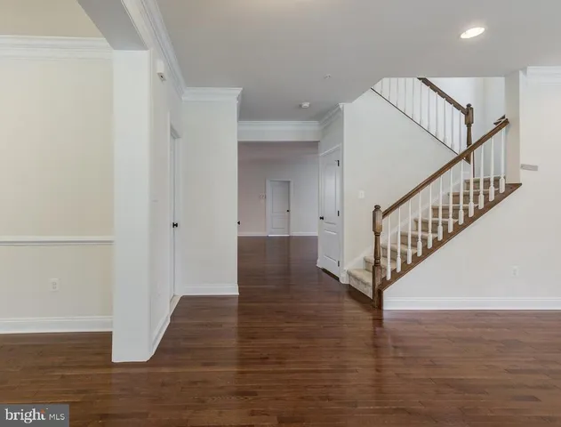 a view of entryway with wooden floor