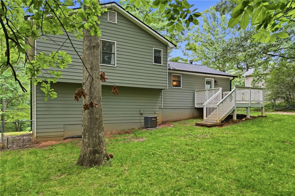404 Brooks Street Dallas, GA 30157 - Photo 32 of 38 a view of a house with a backyard