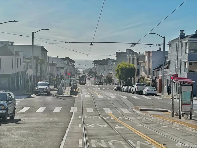 a view of storage and utility room with wooden floor