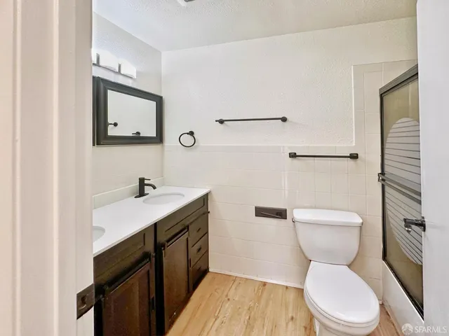 a kitchen with stainless steel appliances a refrigerator sink and cabinets