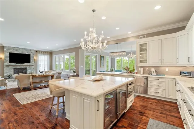 a kitchen with center island and windows