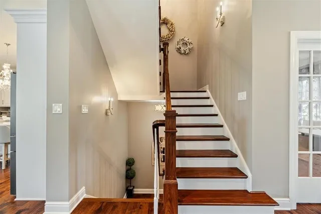 a view of entryway with wooden floor and stairs