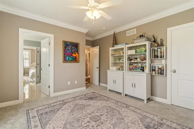 wooden floor with white walls and cabinet