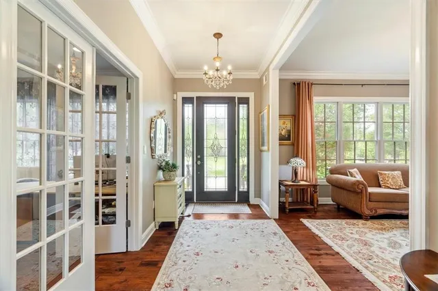 a living room with furniture fireplace and windows