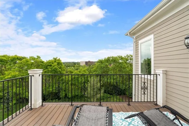 a view of a balcony with two chairs