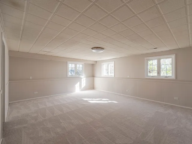 a view of empty room with windows