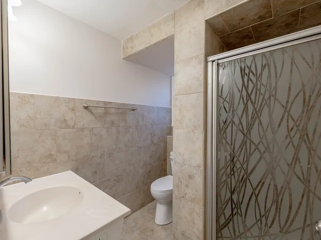 a bathroom with a toilet and a sink