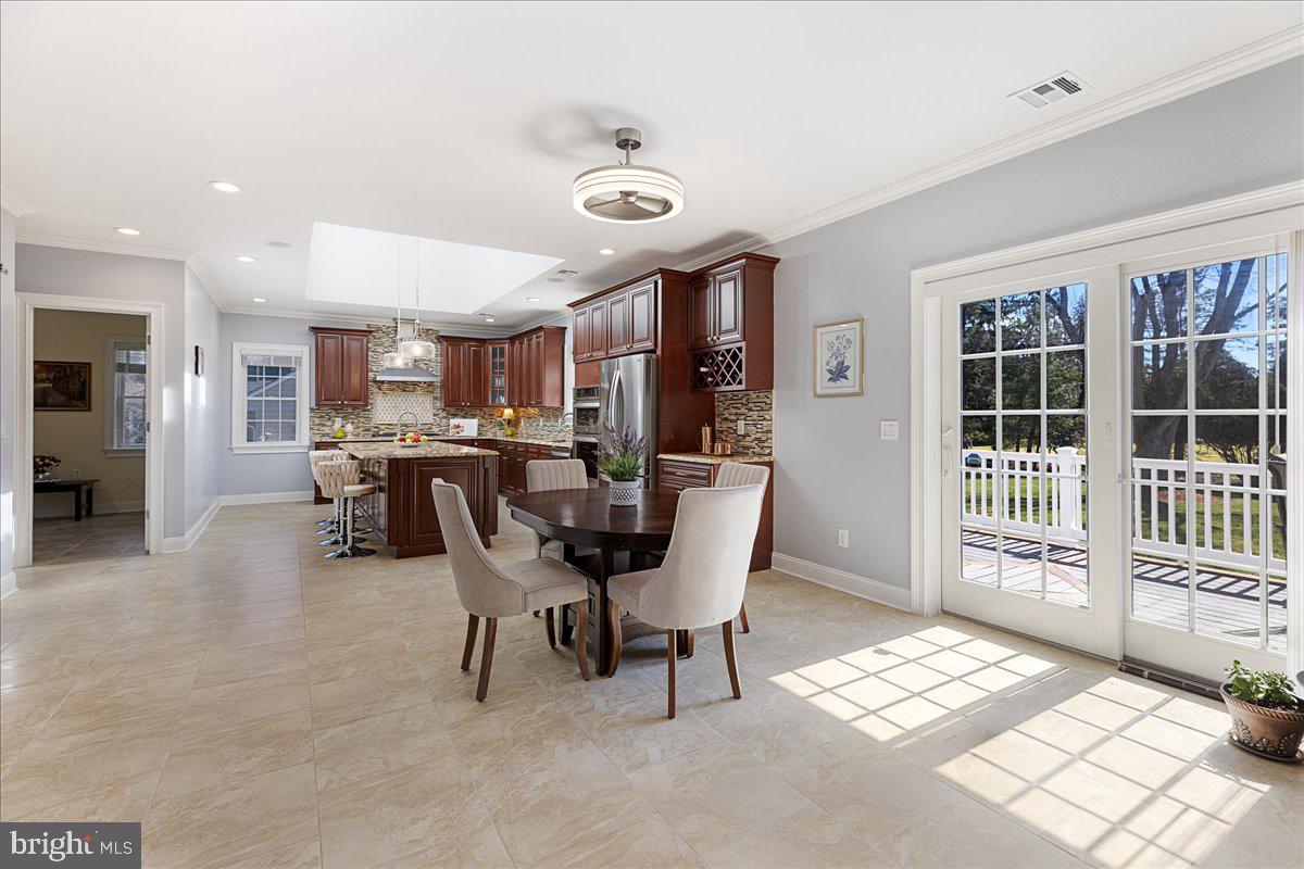535 Village Road West Princeton Junction, NJ 08550 - Photo 12 of 51 a view of a dining room with furniture and a window
