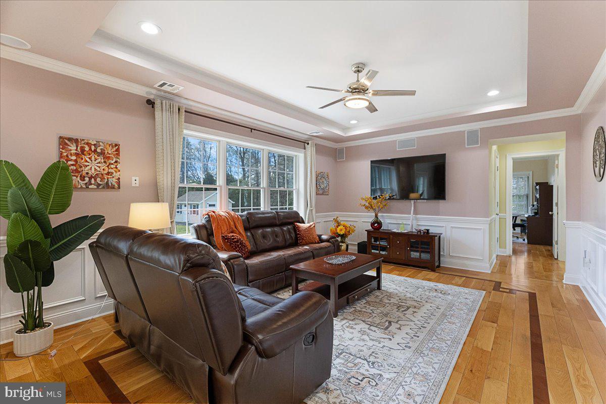 535 Village Road West Princeton Junction, NJ 08550 - Photo 14 of 51 a living room with furniture and a flat screen tv