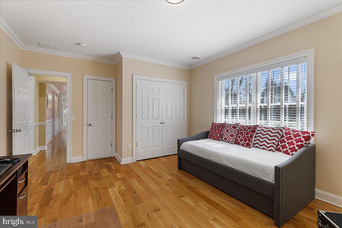 535 Village Road West Princeton Junction, NJ 08550 - Photo 16 of 51 a living room with a couch and a dresser next to a window