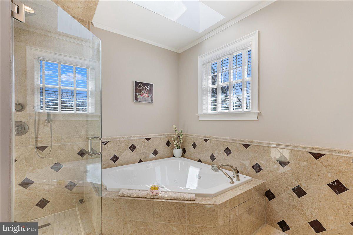 535 Village Road West Princeton Junction, NJ 08550 - Photo 25 of 51 a bath tub sitting in a bathroom next to a window