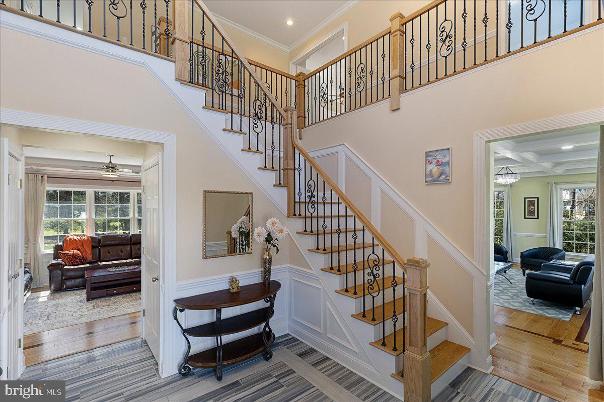 535 Village Road West Princeton Junction, NJ 08550 - Photo 3 of 51 a view of staircase with lots of furniture and a rug