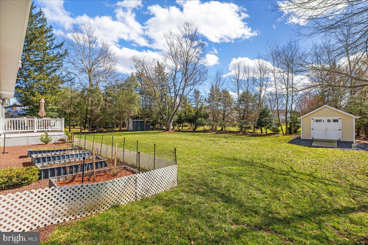 535 Village Road West Princeton Junction, NJ 08550 - Photo 40 of 51 a view of a house with a yard