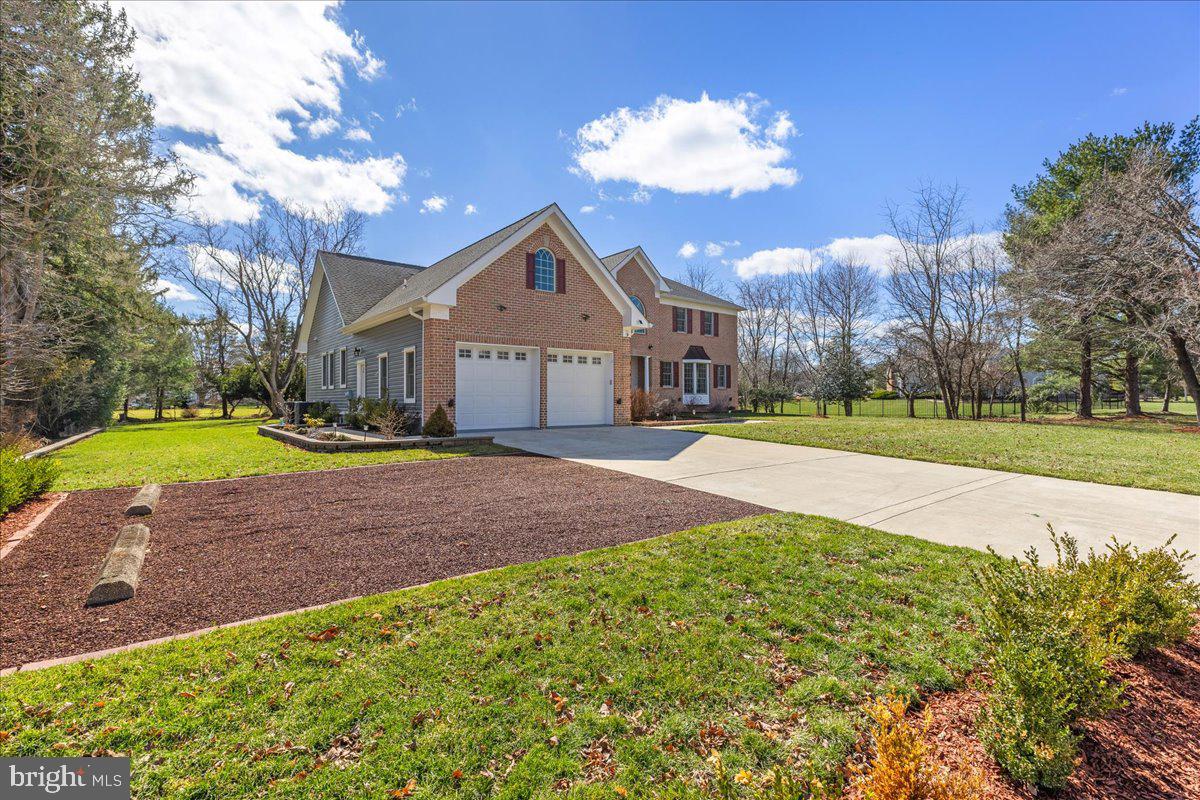 535 Village Road West Princeton Junction, NJ 08550 - Photo 48 of 51 a front view of a house with a big yard