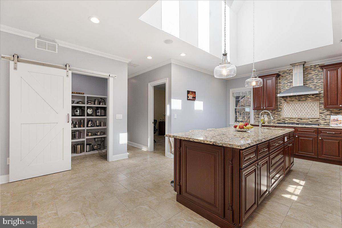 535 Village Road West Princeton Junction, NJ 08550 - Photo 9 of 51 a kitchen with a stove and a refrigerator