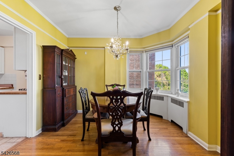 10 Crestmont Road, Unit 3L Montclair, NJ 07042 - Photo 15 of 41 a view of a dining room with furniture and chandelier