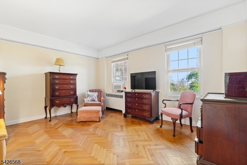 10 Crestmont Road, Unit 3L Montclair, NJ 07042 - Photo 23 of 41 a living room with furniture and a flat screen tv