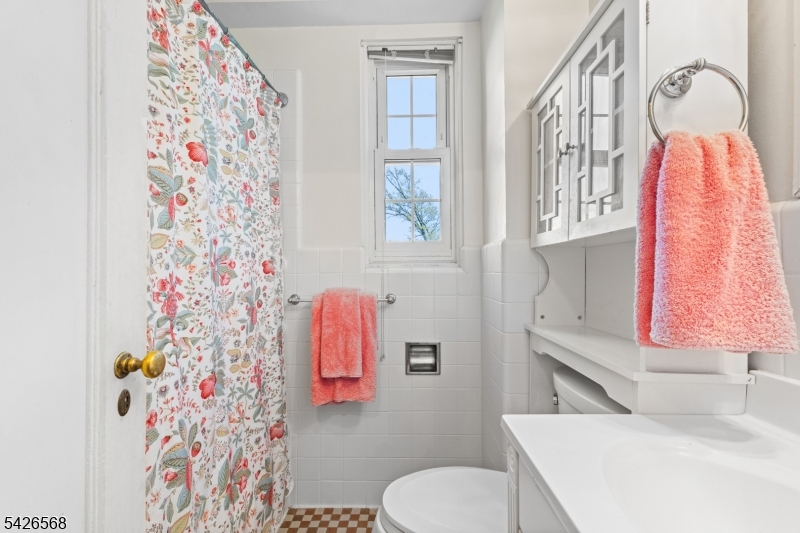 10 Crestmont Road, Unit 3L Montclair, NJ 07042 - Photo 26 of 41 a bathroom with a sink toilet and shower