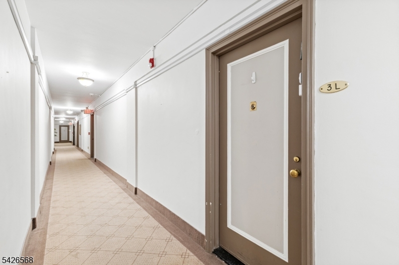 10 Crestmont Road, Unit 3L Montclair, NJ 07042 - Photo 3 of 41 a view of a hallway with wooden floor