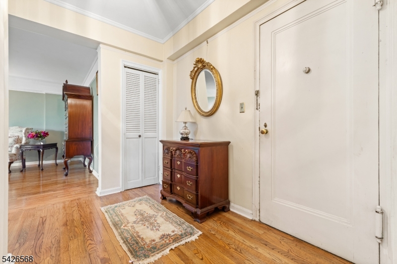 10 Crestmont Road, Unit 3L Montclair, NJ 07042 - Photo 4 of 41 a room with a mirror and a table in it