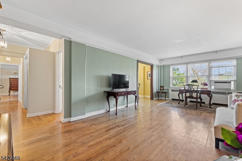 10 Crestmont Road, Unit 3L Montclair, NJ 07042 - Photo 10 of 41 a living room with furniture and a flat screen tv